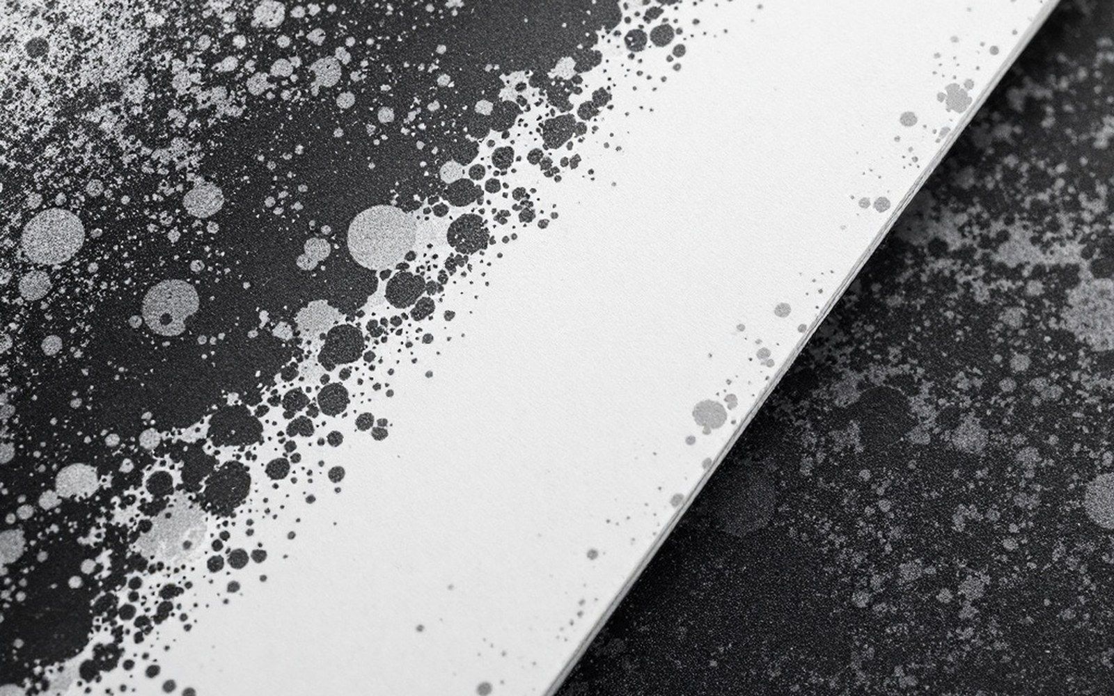 The top corner of a printed magazine cover photographed very close, showing the printed ink texture